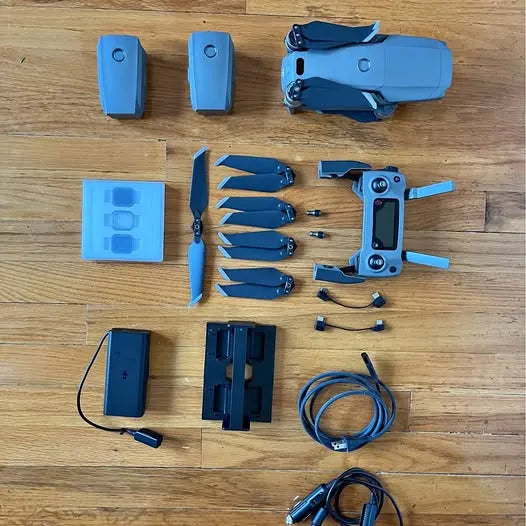 DJI Mavic 2 Pro accessory kit with controller, propellers, batteries, and cables