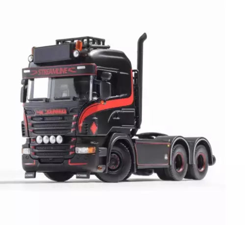 Black diecast tractor unit truck model with red trim and chrome details, 1:64 scale
