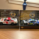 Diecast racecar set with two boxed cars, red #8 and blue #25 with decals