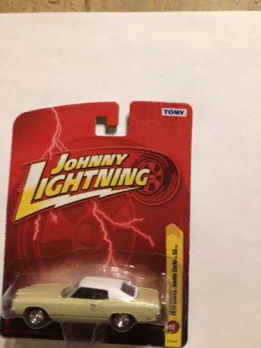 Johnny Lightning diecast car toy, tan and white 1970 Monte Carlo SS on card