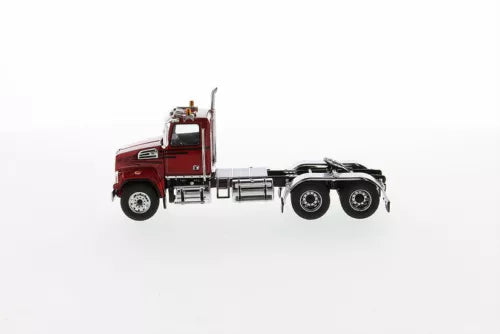 Red diecast tandem day cab tractor model with chrome grille and dual rear wheels