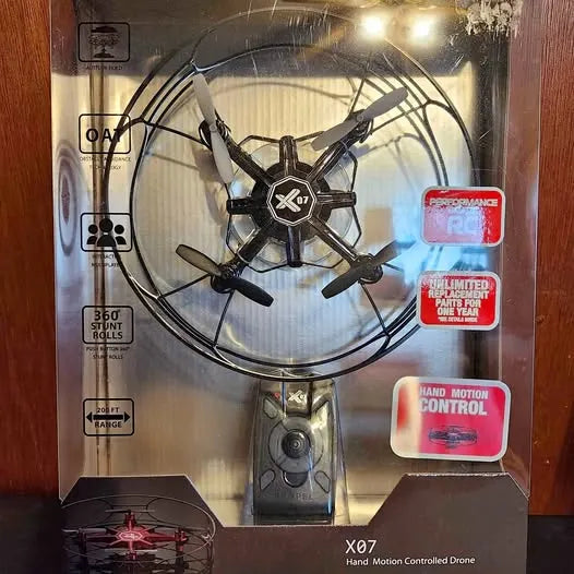 Black X07 hand motion controlled drone with prop guards and four arms