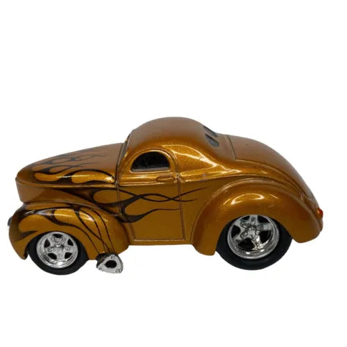 Gold diecast coupe with black flame decals and chrome wheels, side view