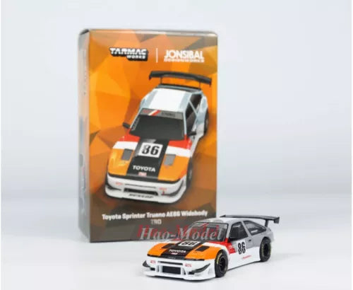 Diecast model car with front view in box, white orange race livery, alloy details
