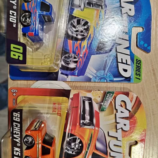 Diecast car set in blister packaging, orange and blue tuned cars
