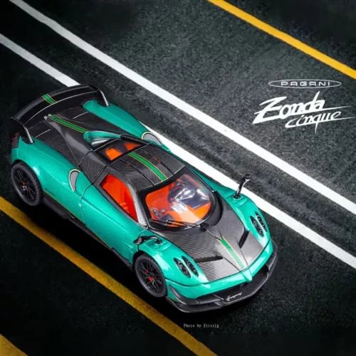 1/24 diecast alloy sports car model in teal with black aero details, front three-quarter view