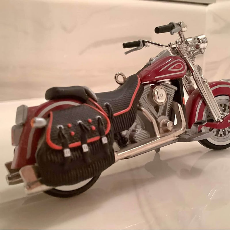 Die-cast motorcycle ornament with red fairing, chrome frame, black seat, and front wheel