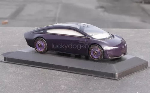 Purple diecast sports car model on display base with detailed rims