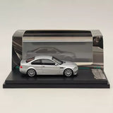 Silver diecast BMW E46 M3 model car on black display base
