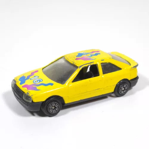 Yellow diecast scale model car with purple graphics, black wheels, side view