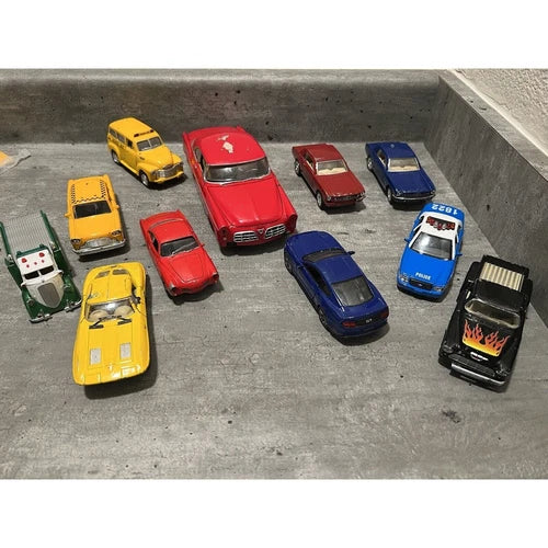 Mixed diecast car lot with assorted yellow, red, blue and black cars