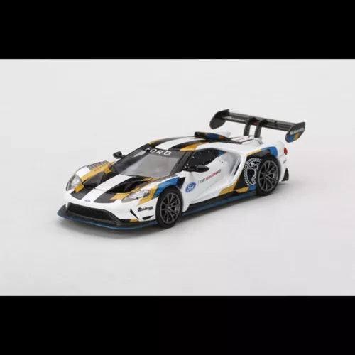 Diecast sports car model in white, yellow, and blue livery with rear wing