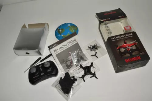Micro drone kit with remote, spare parts, and retail box
