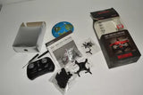 Micro drone kit with remote, spare parts, and retail box