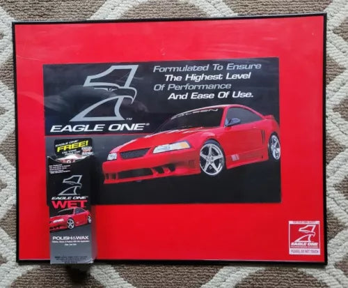 Red framed car promotional poster display with red sports car and Eagle One branding