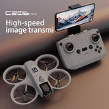 Mini drone toy with white remote controller and phone screen holder