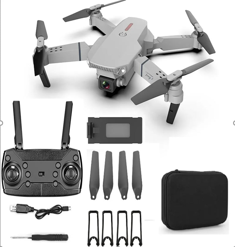 Mini quadcopter drone kit with controller, spare propellers, battery, charging cable and case