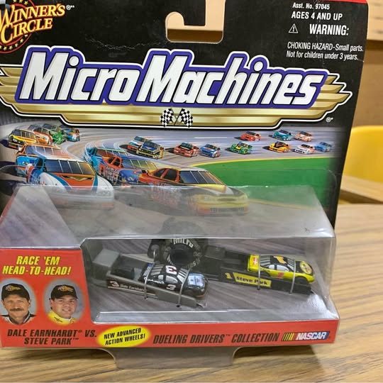 NASCAR diecast car in blister pack, yellow and black race cars, MicroMachines