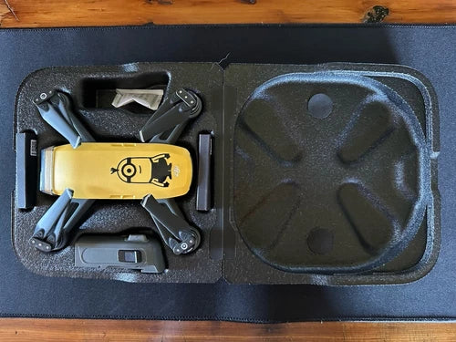Sunrise yellow DJI Spark mini drone and accessories in protective case foam insert