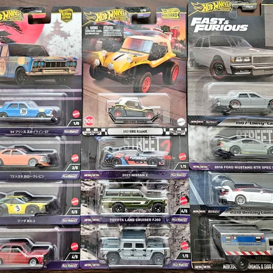 Assorted Hot Wheels premium diecast cars in clear blister packaging