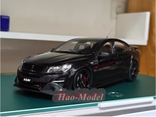 1:18 black diecast model car with red brake calipers, front 3/4 view