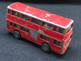 Red diecast bus model with detailed windows and wheels