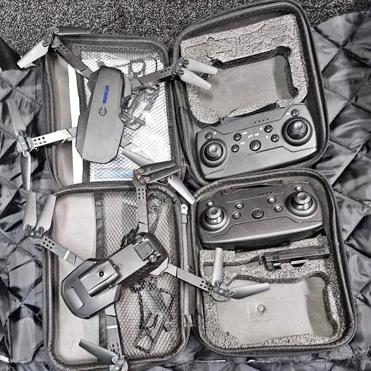 Hard-shell drone case with compact drone parts and controllers