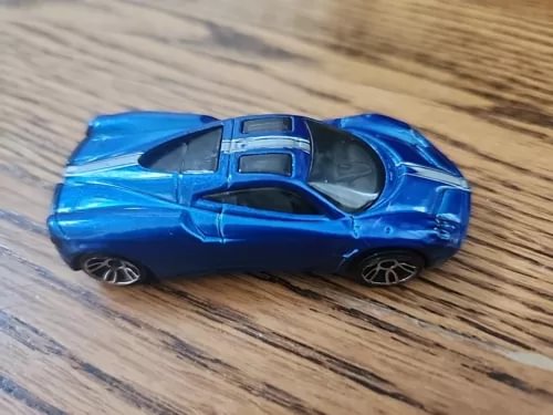 Blue diecast sports car with silver stripes, Hot Wheels 1:64 model