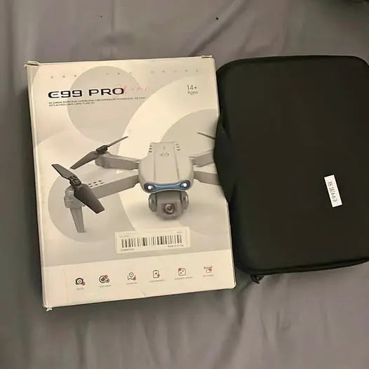 White quadcopter drone with camera and black carrying case