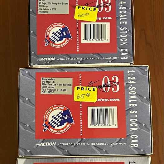 Diecast racing car collectible box, red and black packaging with barcode and logo.