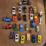 Assorted diecast toy vehicle lot with cars and motorcycles in various colors