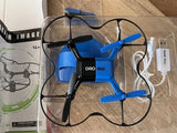 Blue stunt drone with four propellers, label DRO 002