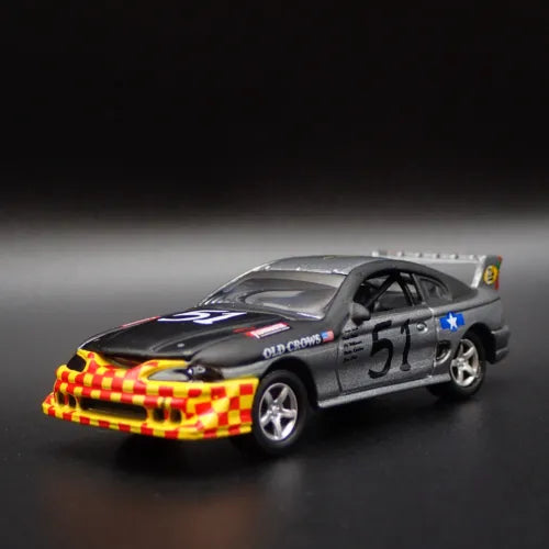 Diecast model car, gray-black with checkered hood and blue star decals, #51