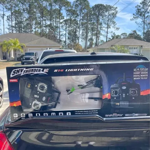 RC drone box with blue and black graphics, two controller remotes shown on front