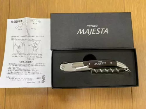 Silver diecast car model with MAJESTA logo in open black display box