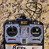 8-channel RC drone controller with dual joysticks and screen