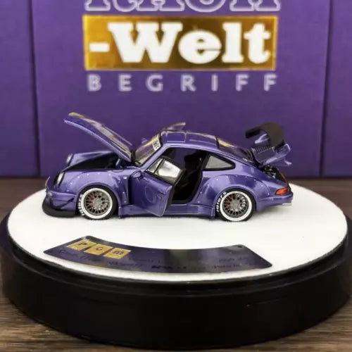 Purple diecast Porsche 930 model car with open doors