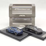 Diecast hybrid supercar model display with two cars, blue and dark gray, on bases