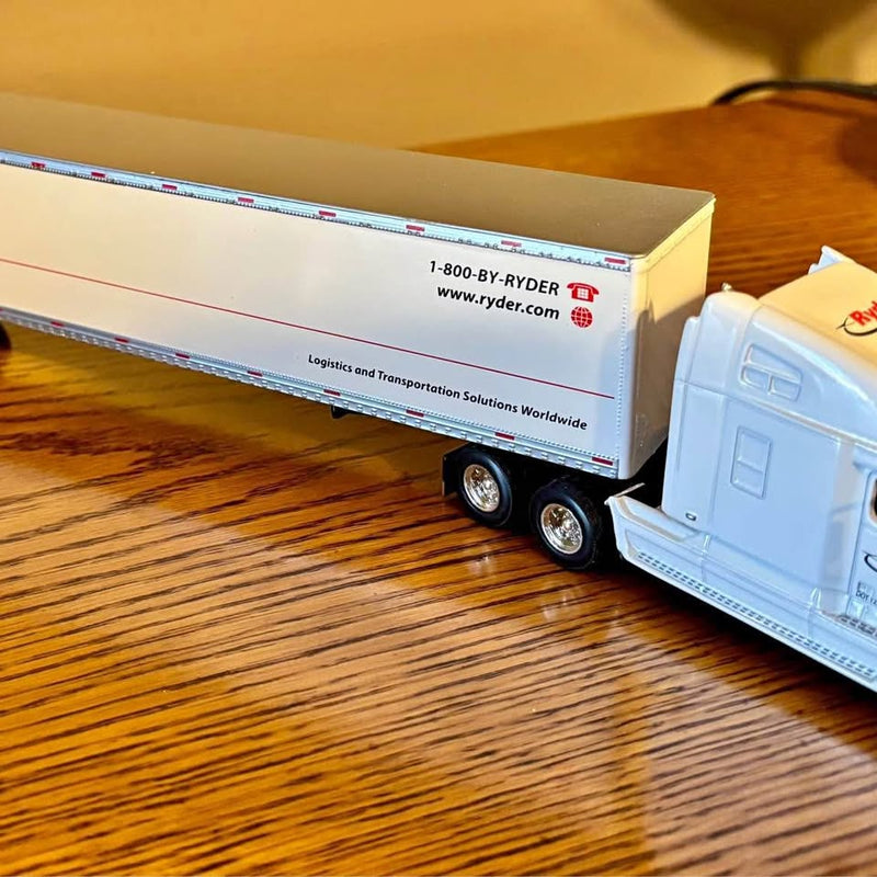 Light blue diecast Ryder tractor trailer replica with blue cab and twin wheels