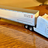 Light blue diecast Ryder tractor trailer replica with blue cab and twin wheels