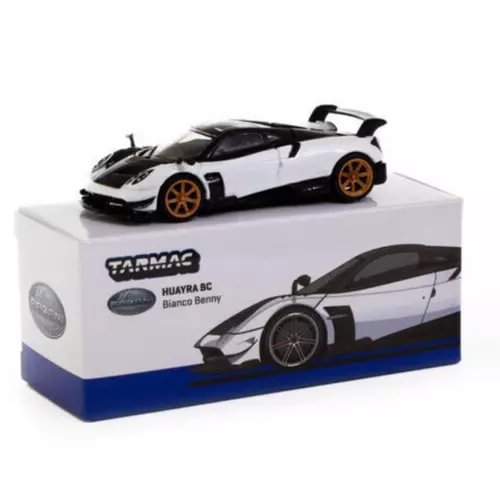 1:64 diecast sports car, white with black accents, orange wheels, on display box