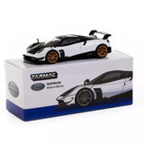 1:64 diecast sports car, white with black accents, orange wheels, on display box