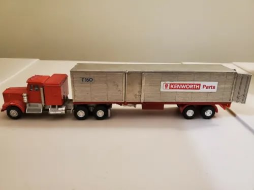 Kenworth Parts T160 diecast truck with red cab and gray/white cargo box