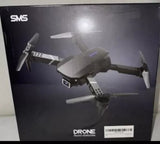 SMS obstacle-avoidance drone with 4K camera, shown on sealed retail box