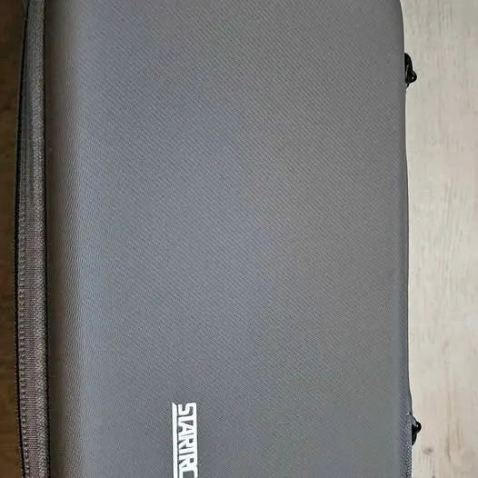 DJI drone bag and Osmo Pocket 3 case with gray fabric exterior and zipper edge