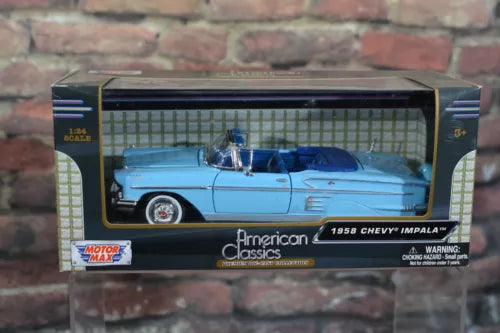 1:24 scale diecast 1958 Chevy Impala convertible model in blue, in display box