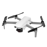White quadcopter drone with 4 propellers and front camera