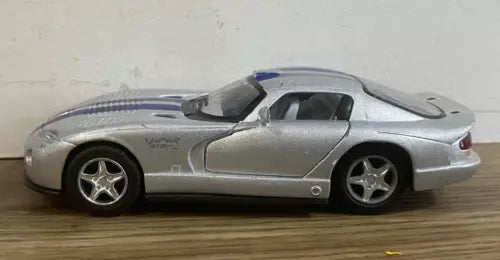 Silver diecast model car of a sports coupe with pull-back action, side view