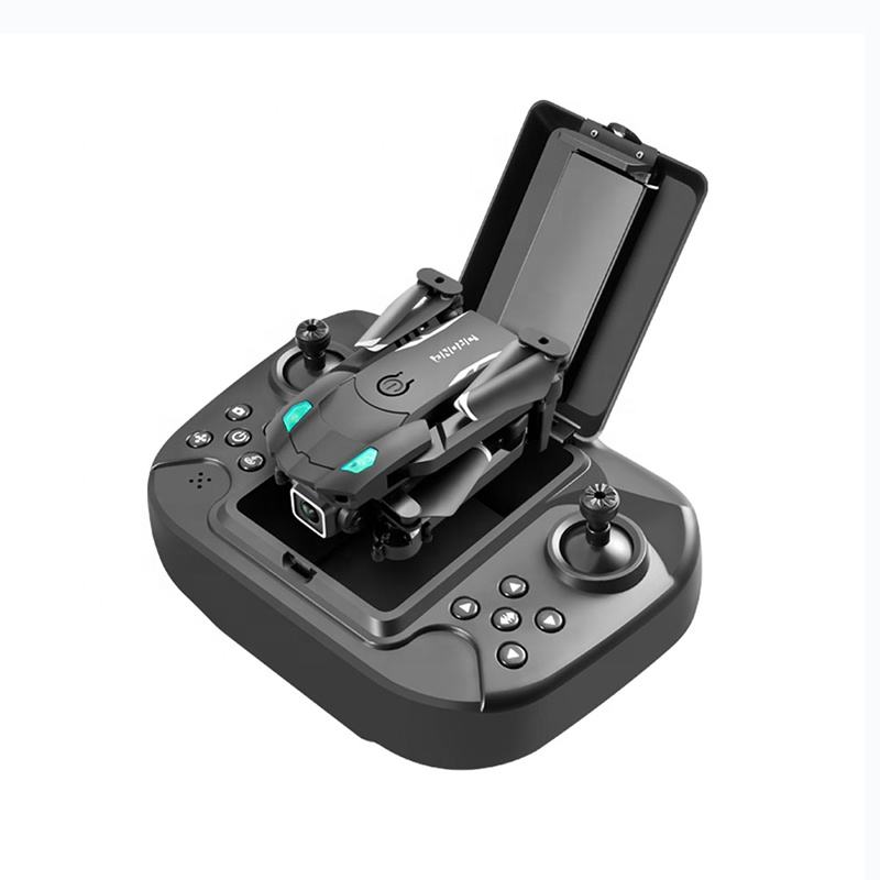 Mini quadcopter drone on controller base with built-in screen and joysticks