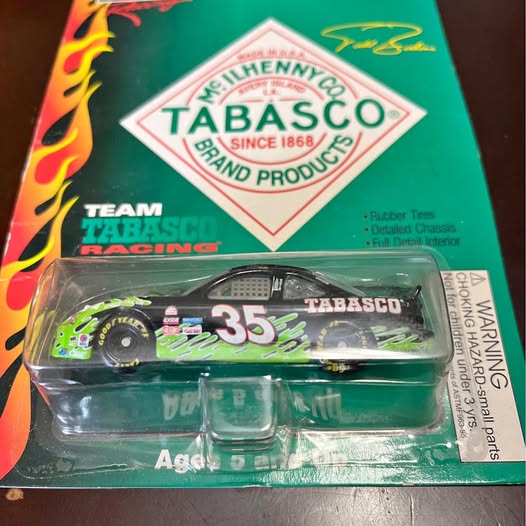 Diecast racing car replica #35 with Tabasco livery in green blister packaging